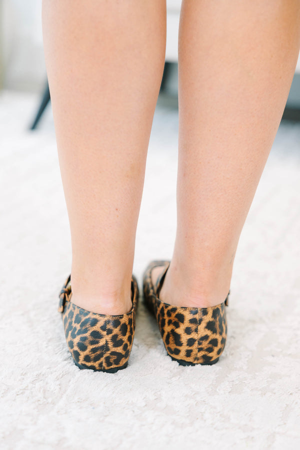 Leopard print Mary Jane flats with a buckle strap and square toe.