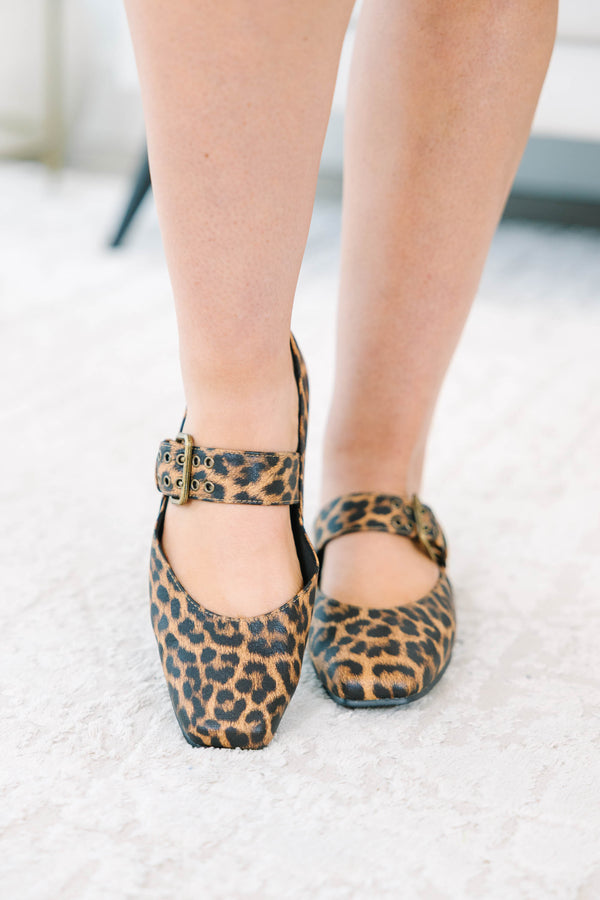 Leopard print Mary Jane flats with a buckle strap and square toe.