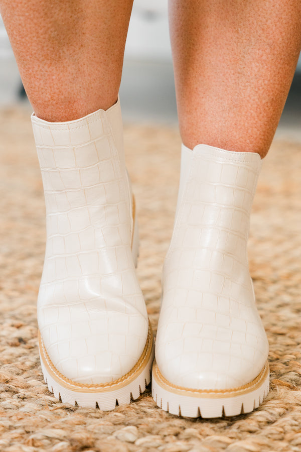 ivory chelsea booties with ivory heel and alligator print detailing with round-toe and light brown stitching along seams 