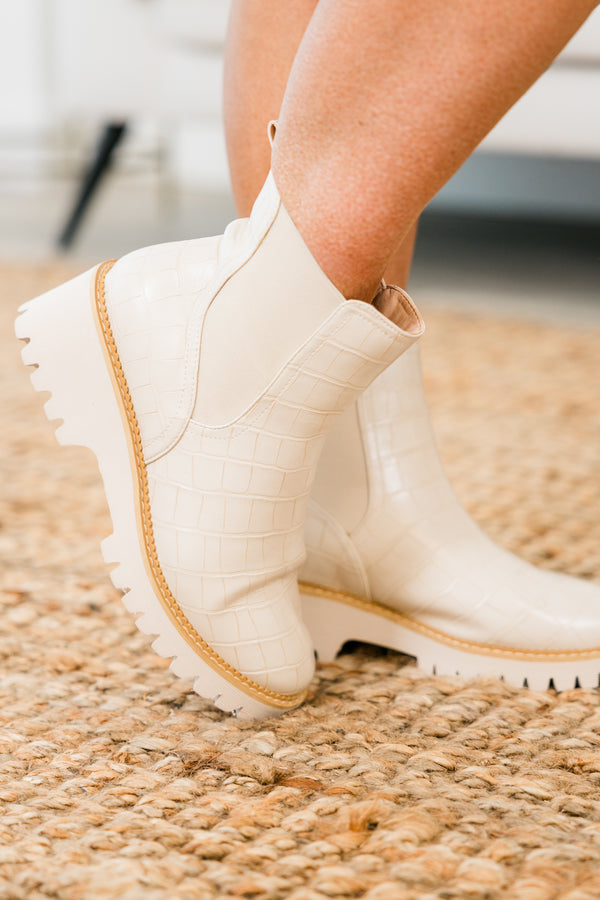 ivory chelsea booties with ivory heel and alligator print detailing with round-toe and light brown stitching along seams 