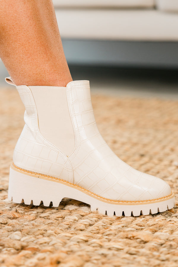 ivory chelsea booties with ivory heel and alligator print detailing with round-toe and light brown stitching along seams 