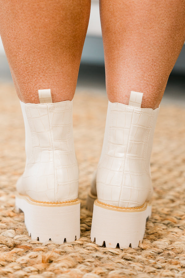 ivory chelsea booties with ivory heel and alligator print detailing with round-toe and light brown stitching along seams 