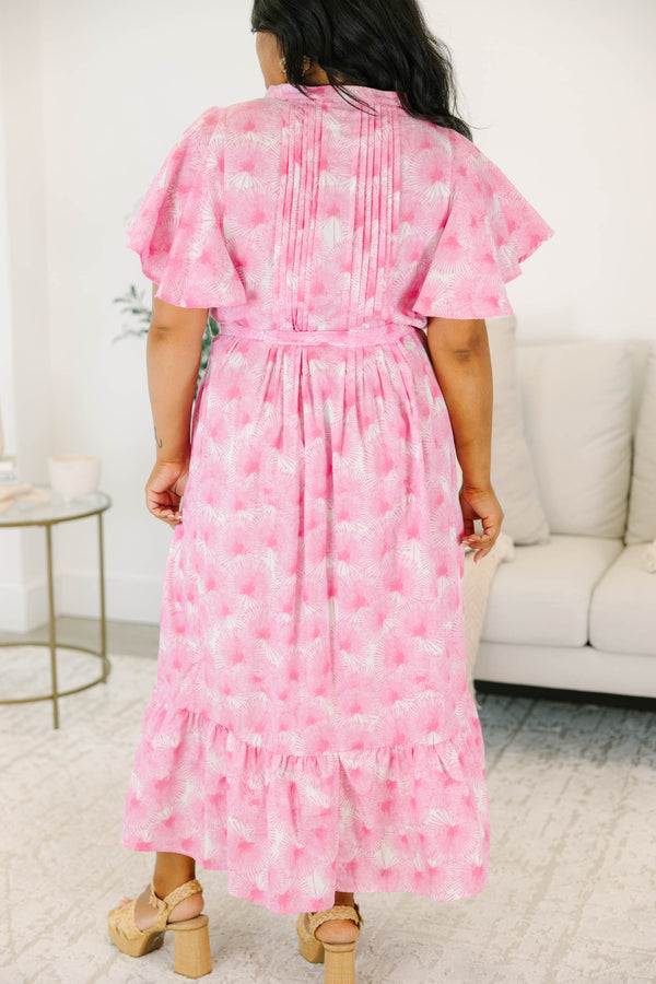 Plus size pink floral midi dress with ruffle sleeves, a tie waist, and flowy tiered skirt.