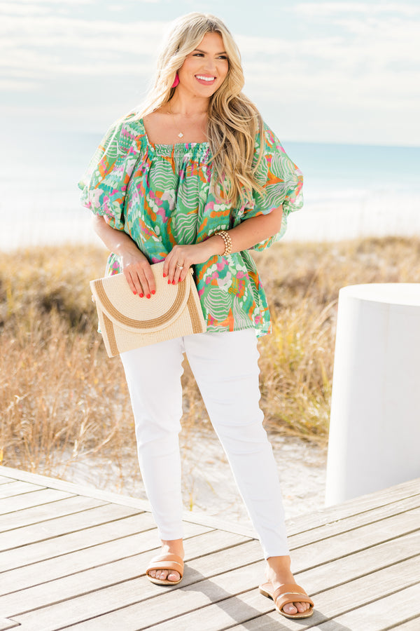 Chic Soul plus size clothing, short sleeve green tropical multicolored abstract print top with v neckline and smock detail on chest with flowy flutter sleeves