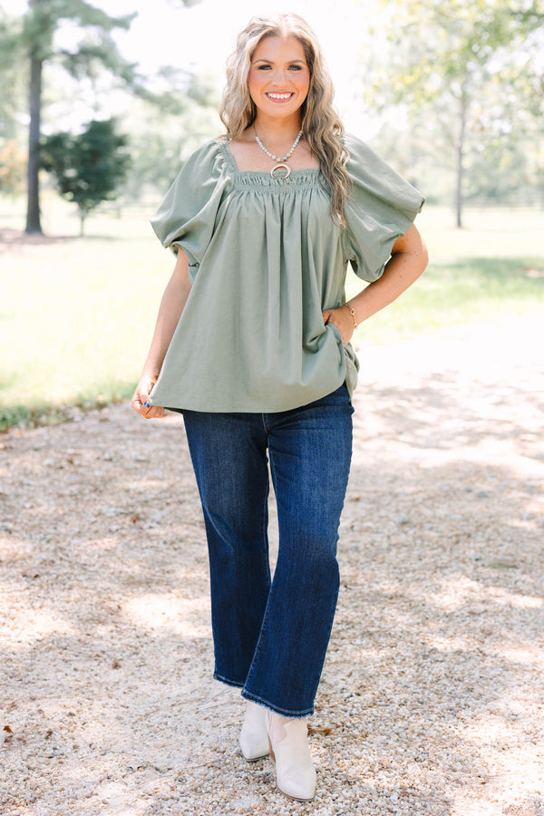 Plus size olive corduroy blouse with puff sleeves and a flowy fit.