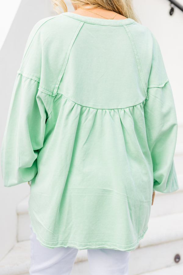 Chic Soul plus size clothing, mint long sleeve pullover with button up detail on neckline with cuffed puff sleeves with raw hem along bottom
