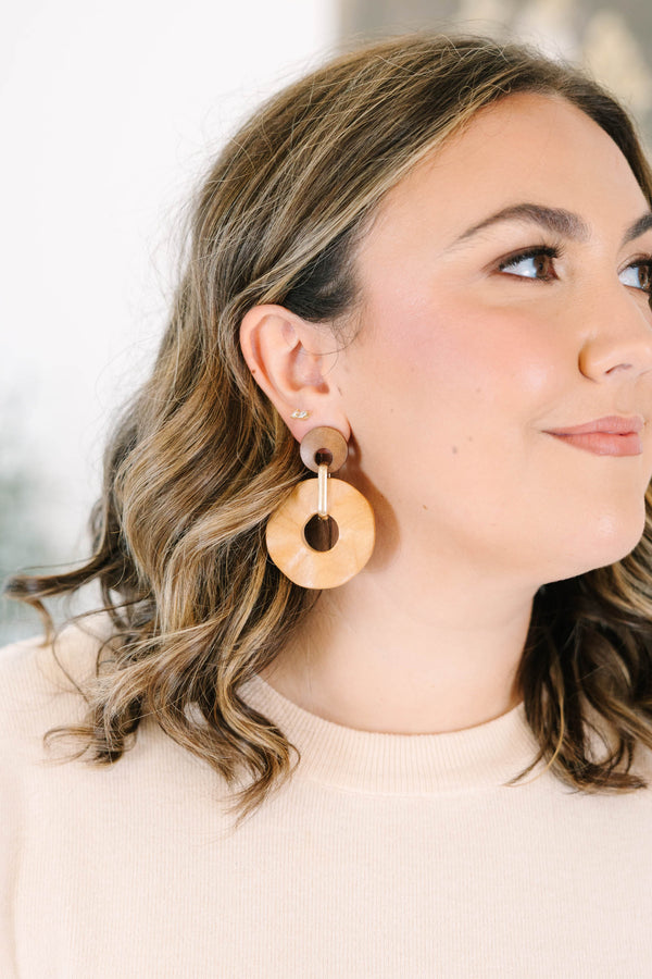 Plus Size brown wooden drop earrings featuring two circular discs connected by a gold metal link.