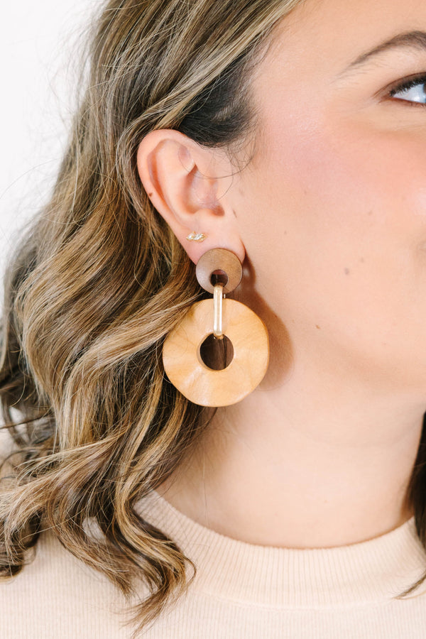 Plus Size brown wooden drop earrings featuring two circular discs connected by a gold metal link.