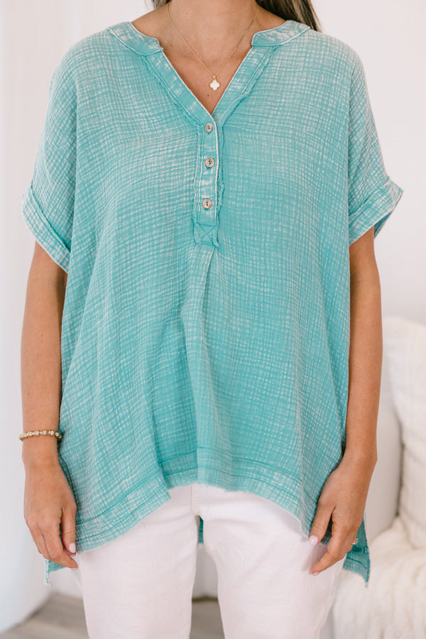 Chic Soul plus size clothing, short-sleeve cuffed dusty teal green mineral washed top with a buttoned v-neckline and a high-low hemline