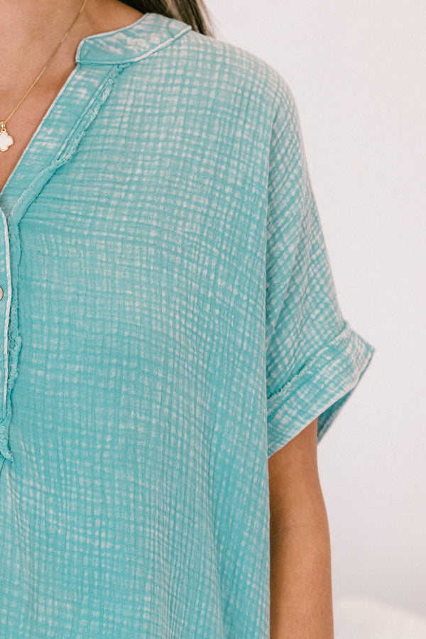 Chic Soul plus size clothing, short-sleeve cuffed dusty teal green mineral washed top with a buttoned v-neckline and a high-low hemline