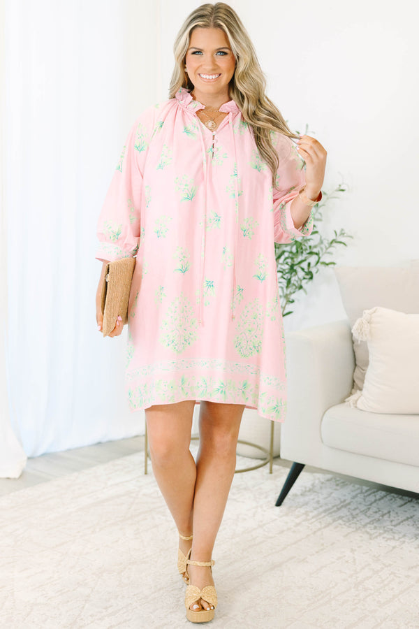 Plus size pink botanical print dress with ruffle split neckline and balloon 3/4 sleeves.