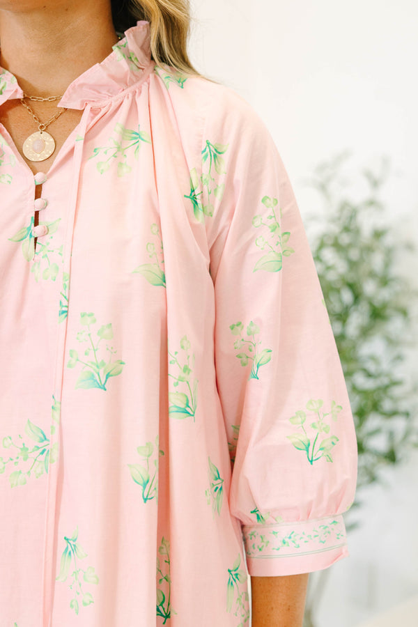 Plus size pink botanical print dress with ruffle split neckline and balloon 3/4 sleeves.