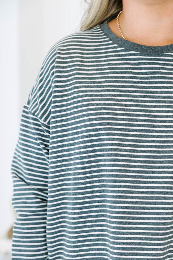 Plus Size charcoal and white horizontal striped long sleeve top with a crew neckline.