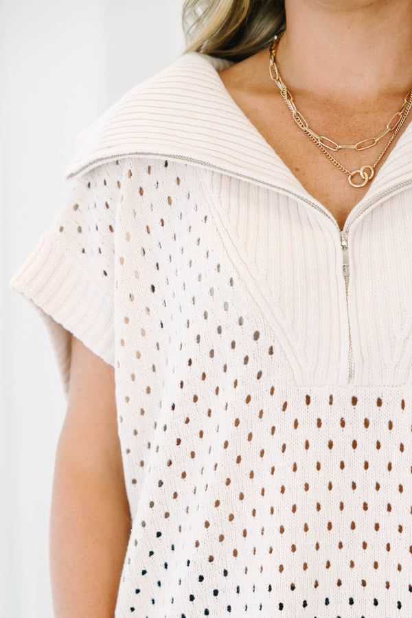 Plus Size taupe knit sweater with a quarter-zip collar, short sleeves, and open-stitch pattern.