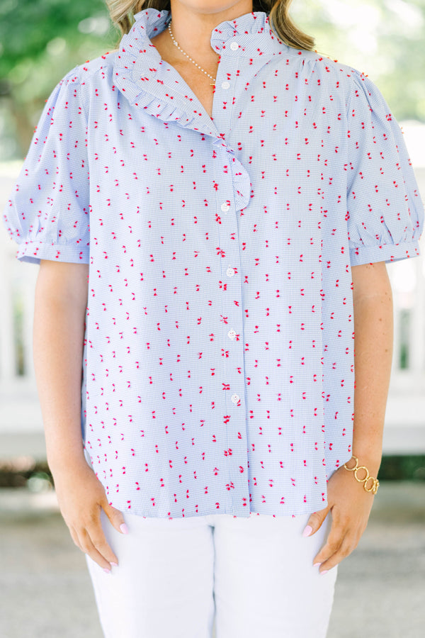 Plus Size blue gingham button-down top with red embroidery, ruffled collar, and puff sleeves.