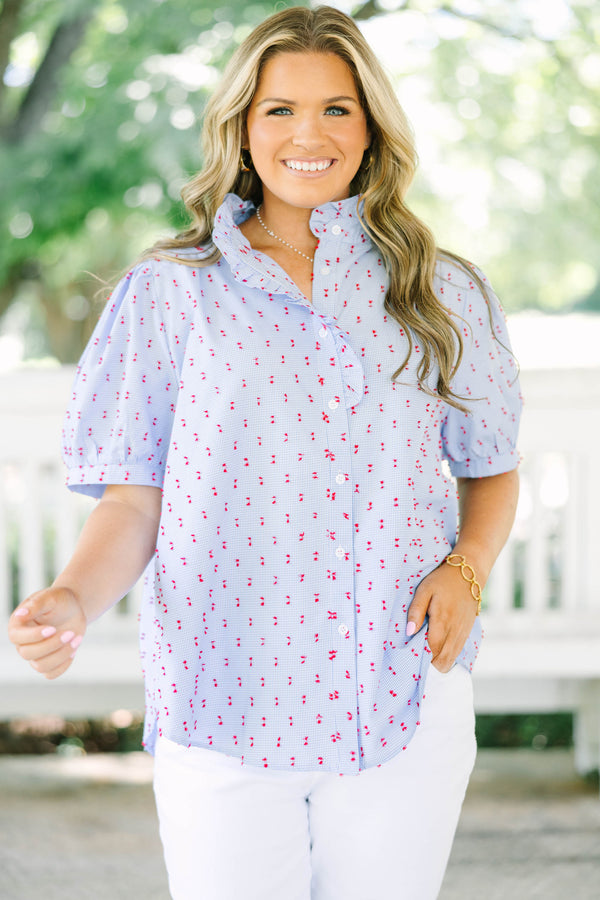 Plus Size blue gingham button-down top with red embroidery, ruffled collar, and puff sleeves.