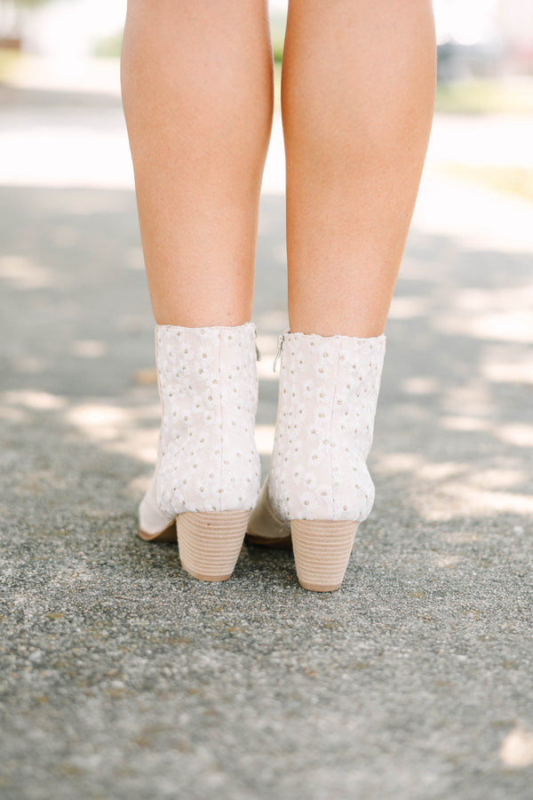 Plus Size beige pointed-toe booties with a block heel and floral daisy embroidery on the back.