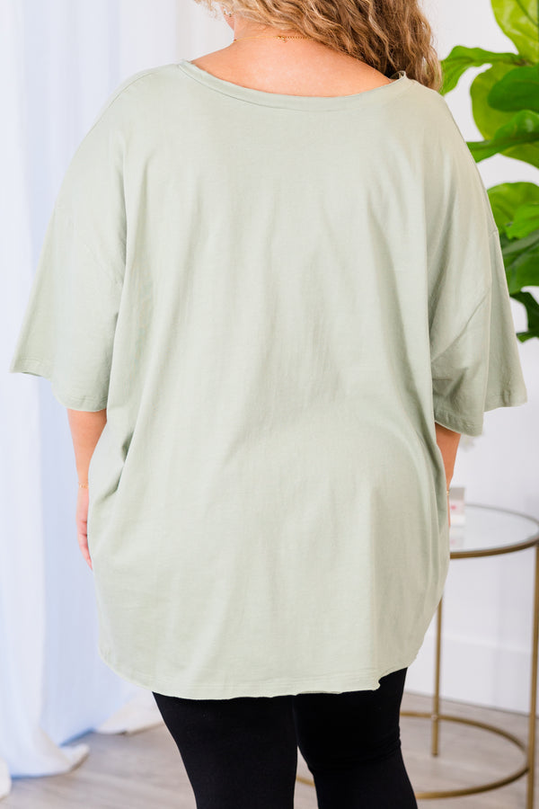 Chic Soul plus size clothing, light sage top with short sleeves, v-neckline, and left chest pocket