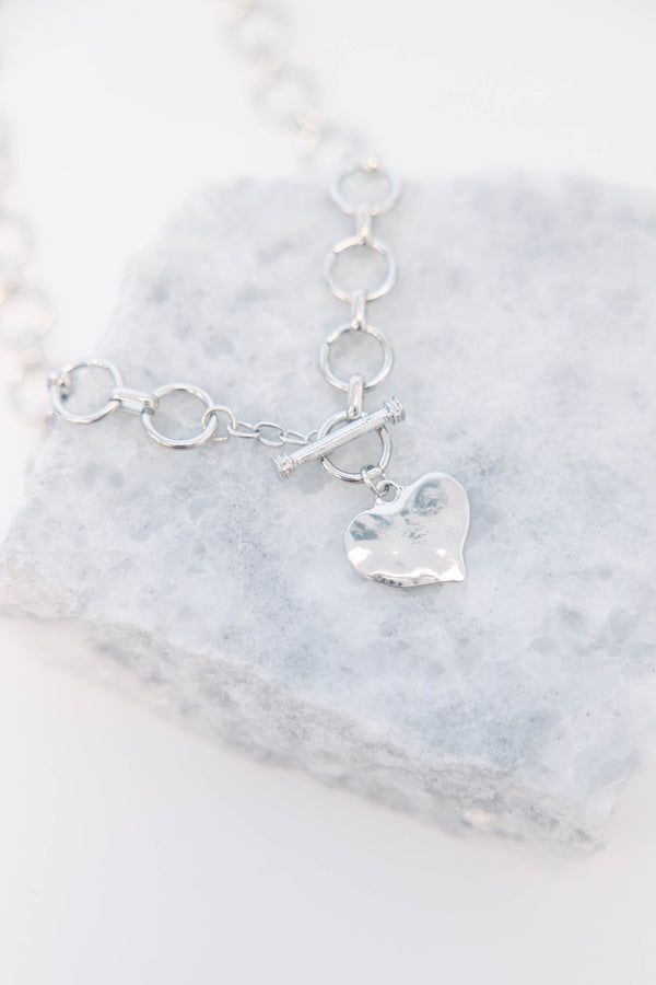 Plus Size silver chain necklace featuring a hammered heart pendant and a toggle clasp.