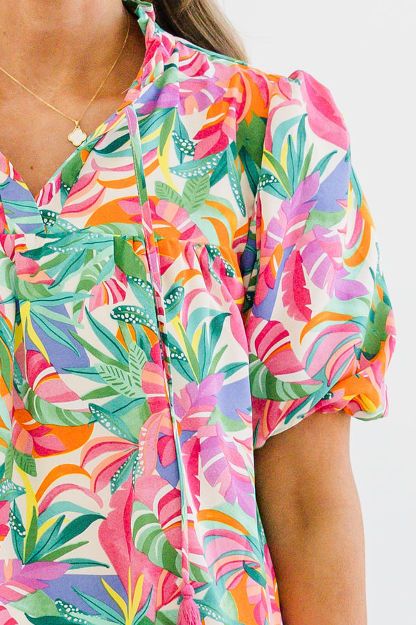 Chic Soul plus size clothing, short-puffed-sleeve green multi-colored top with a split-v-neckline with a green and pink tassel with a multi-colored watercolor floral pattern