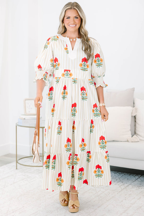 Plus Size cream tiered maxi dress with vertical stripes, red floral print, and smocked puff sleeves.