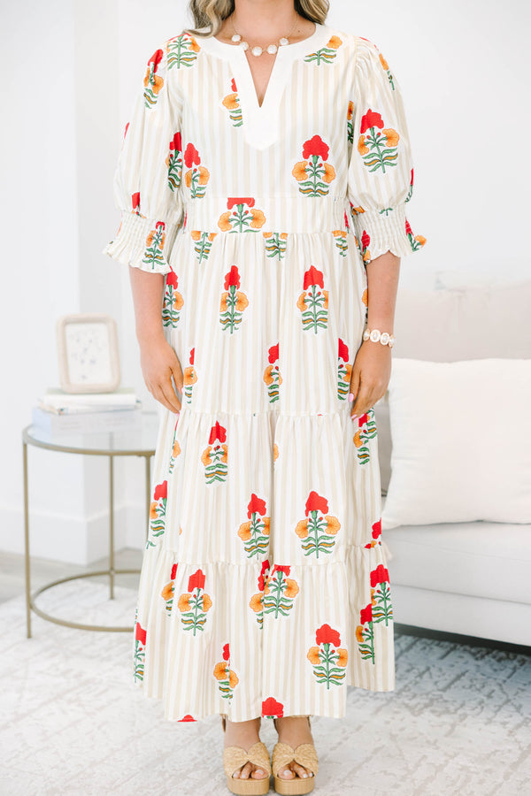 Plus Size cream tiered maxi dress with vertical stripes, red floral print, and smocked puff sleeves.