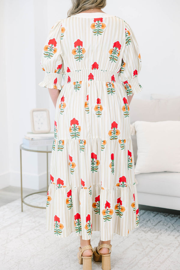 Plus Size cream tiered maxi dress with vertical stripes, red floral print, and smocked puff sleeves.