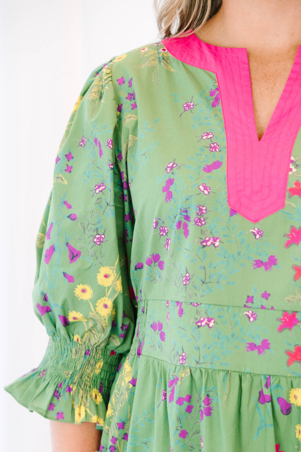 Plus Size green floral tiered maxi dress with pink V-neck trim and ruffled puff sleeves.