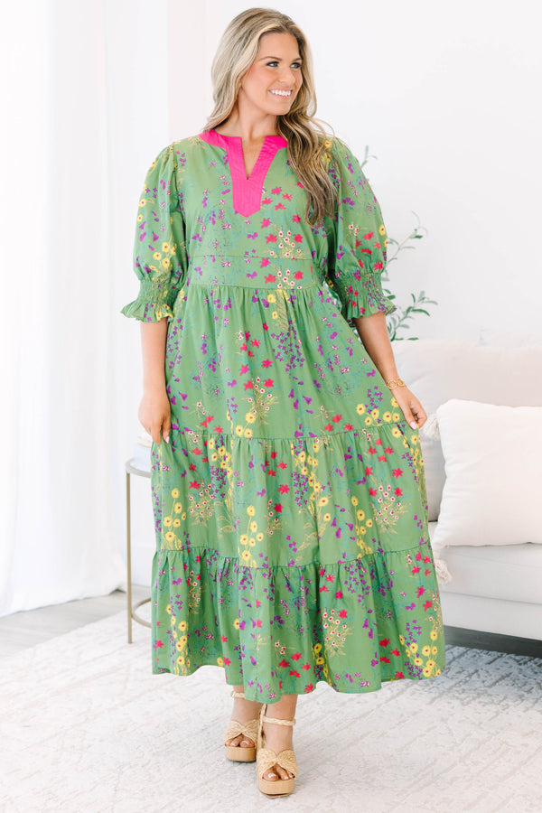 Plus Size green floral tiered maxi dress with pink V-neck trim and ruffled puff sleeves.