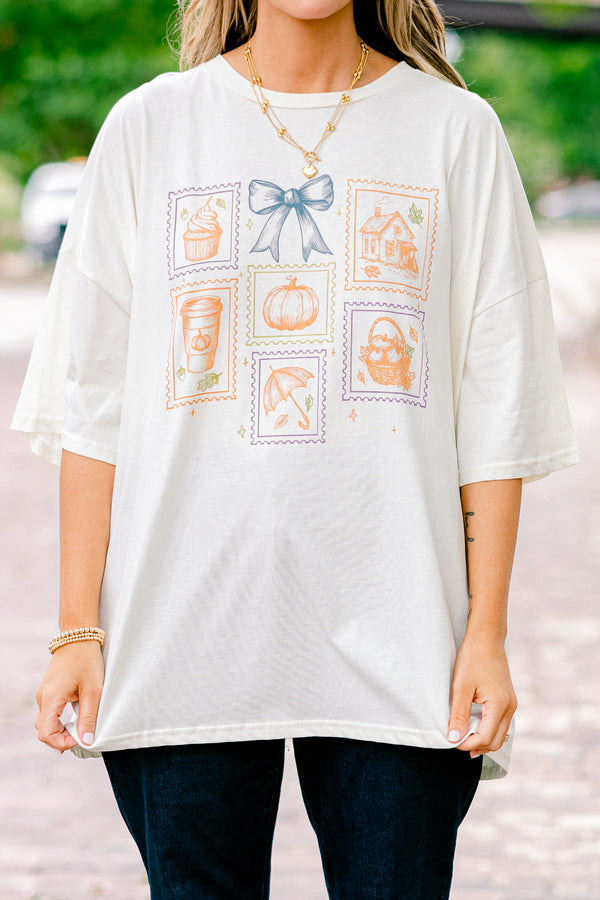 Chic Soul plus size clothing, ivory graphic tee with all post stamp graphics on the center of the shirt and a blue bow above them