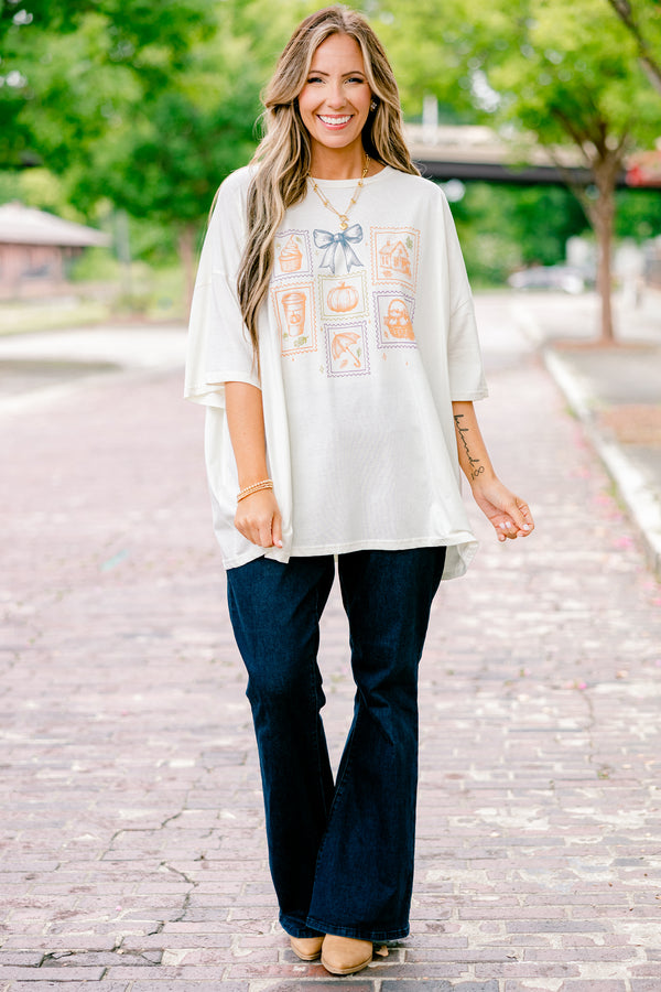 Chic Soul plus size clothing, ivory graphic tee with all post stamp graphics on the center of the shirt and a blue bow above them
