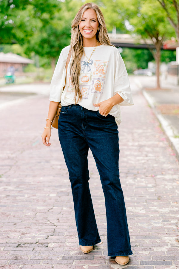 Chic Soul plus size clothing, ivory graphic tee with all post stamp graphics on the center of the shirt and a blue bow above them