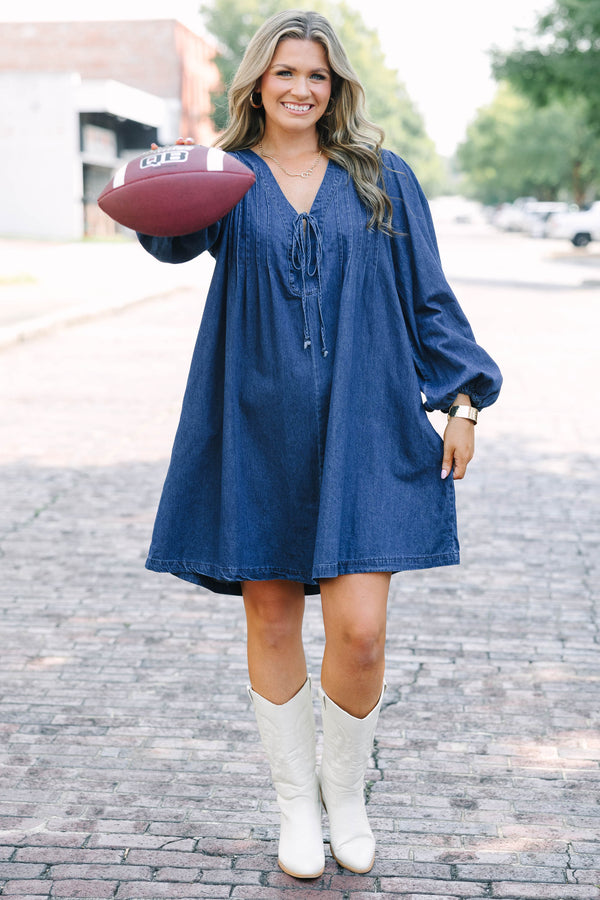 Chic Soul plus size clothing, blue denim long sleeve dress with a v-neckline and a bow detail on the center of the neckline 