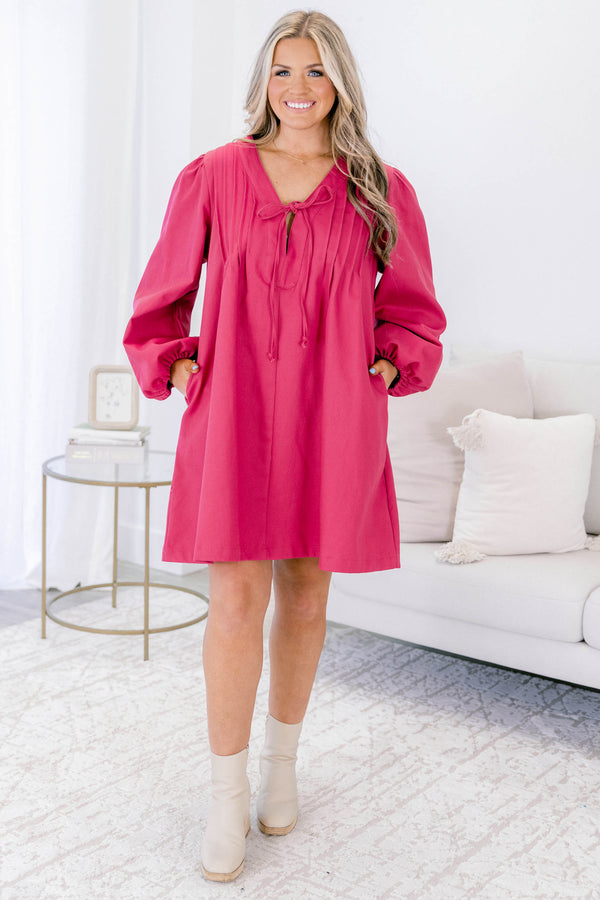 Plus Size fuchsia cotton v-neck dress with pleated front, tie detail, and elastic balloon sleeves.