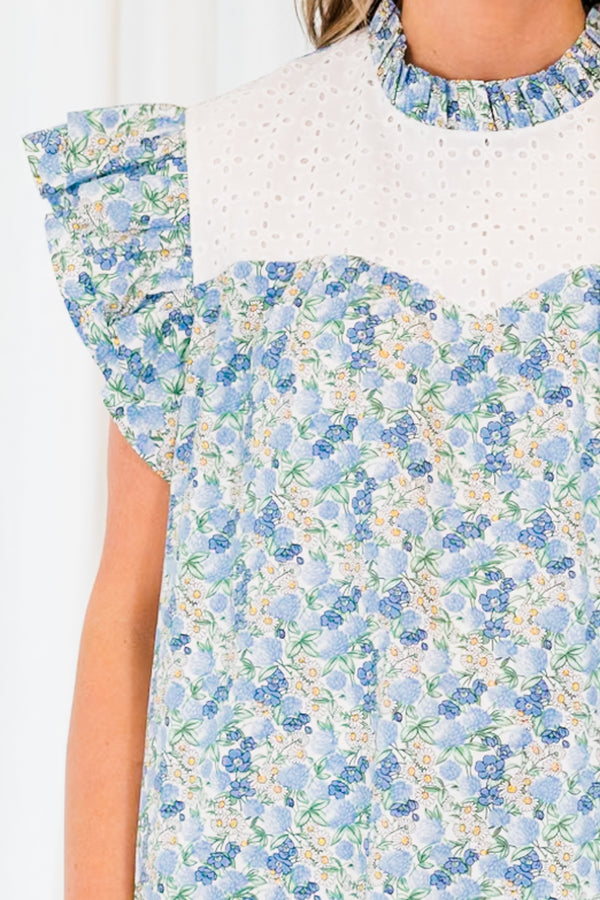 Chic Soul plus size clothing, blue floral short sleeve top with ruffle sleeves and white eyelet chest detailing