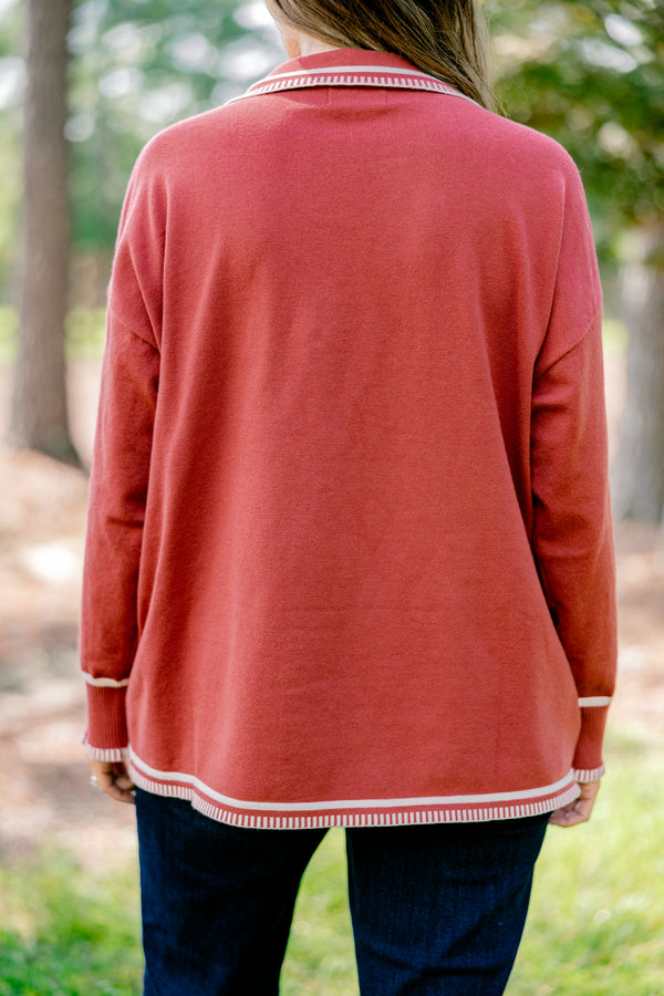 Chic Soul plus size clothing, rust red long sleeve v-neck sweater with collar with white stitching details around the collar, neckline, hem, and sleeves