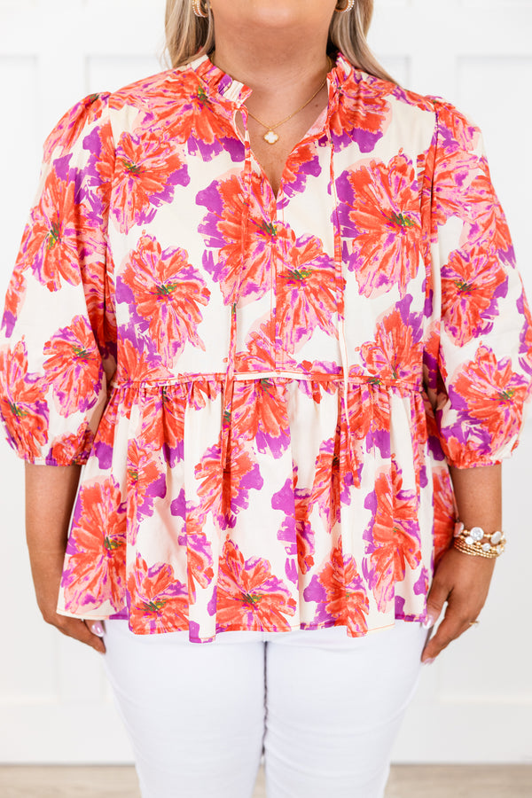 Chic Soul plus size clothing, short-puffed-sleeve pink baby doll top with a split-v-neckline and tassels with a purple and pink floral pattern 
