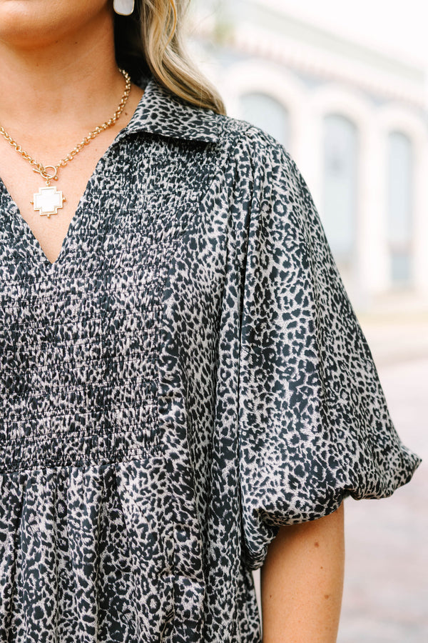 Plus Size leopard print top with smocked bust, collar, and short puff sleeves.