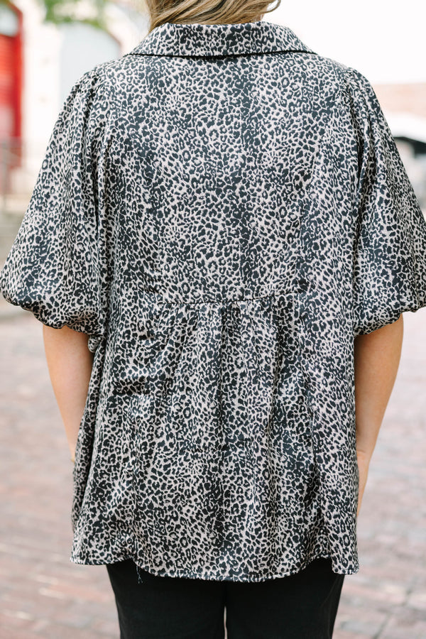 Plus Size leopard print top with smocked bust, collar, and short puff sleeves.