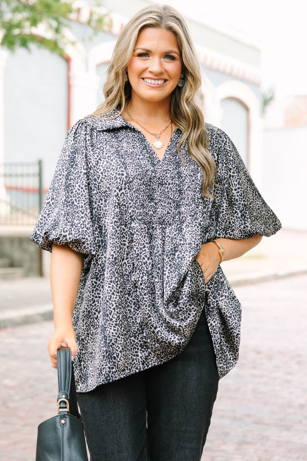 Plus Size leopard print top with smocked bust, collar, and short puff sleeves.