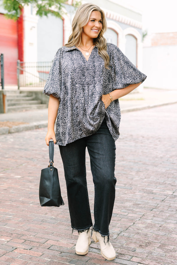 Plus Size leopard print top with smocked bust, collar, and short puff sleeves.