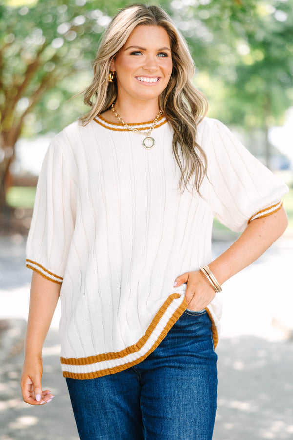 Plus size woman in oatmeal ribbed knit top with mustard stripes