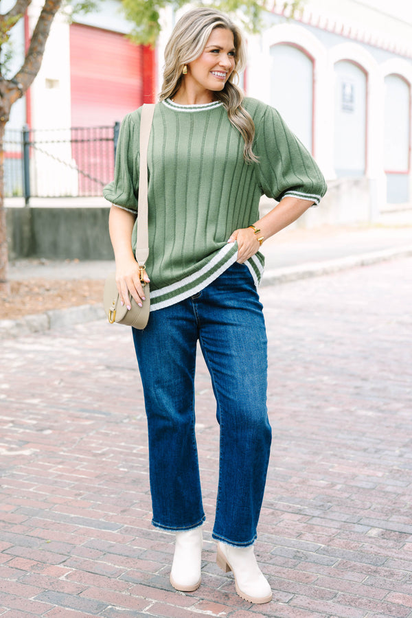 Plus Size olive green ribbed knit sweater top with white striped trim on the neck, sleeves and hem.