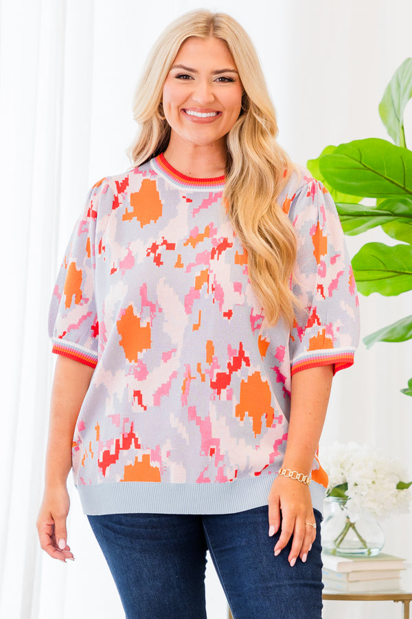 Chic Soul plus size clothing, short-sleeve puffed sleeve knit powder blue top with orange and pink camo pattern and lined pattern on sleeves and neckline 