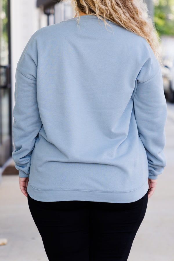 Chic Soul plus size clothing, long-sleeve denim blue crewneck sweatshirt with white graphic lettering stating 