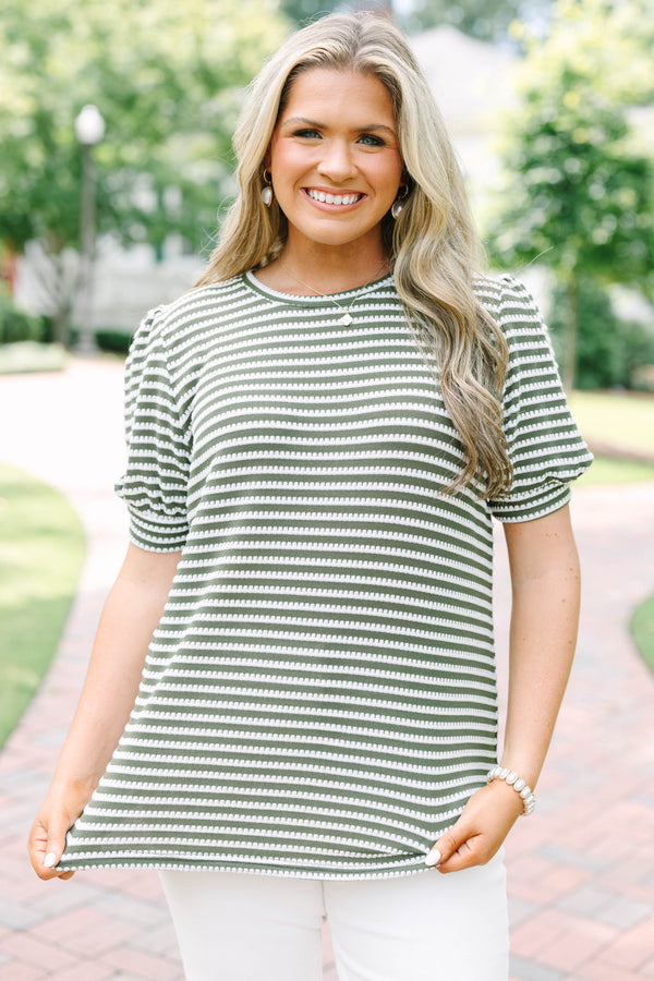 Plus size olive green top with white stitched stripes, puff sleeves, and a relaxed, flowy fit.