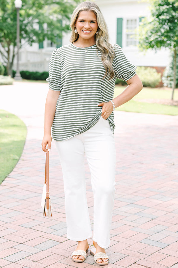 Plus size olive green top with white stitched stripes, puff sleeves, and a relaxed, flowy fit.