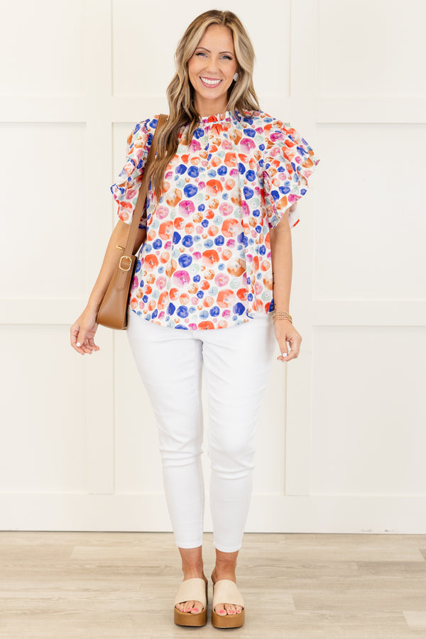 Chic Soul plus size clothing, white short sleeve top with multi dot design with flare ruffle sleeves with ruffle detail along neckline