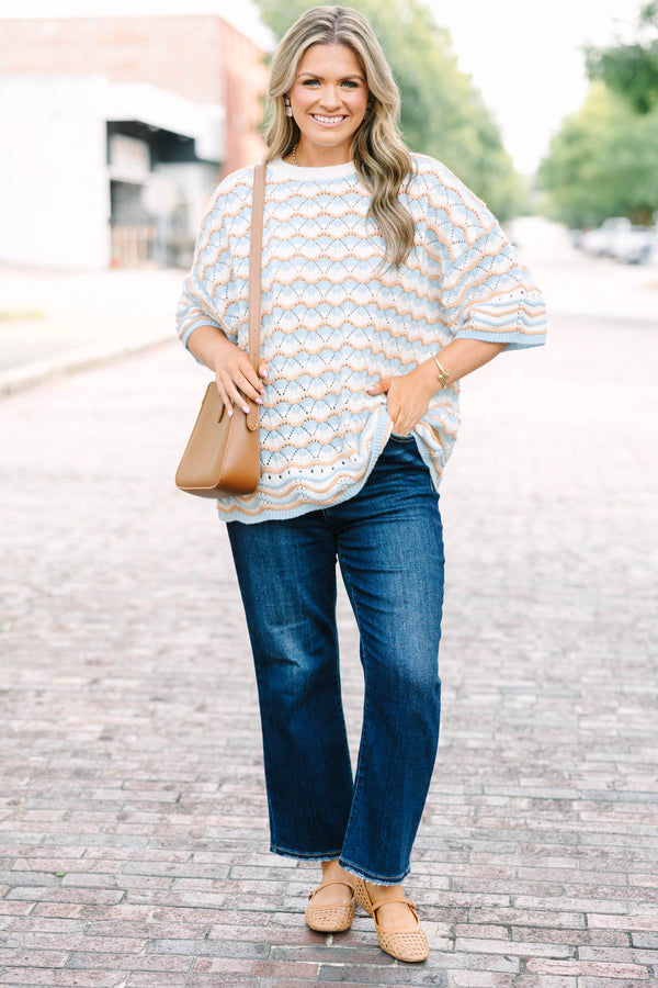 Plus Size blue and tan wavy knit drop shoulder sweater with short sleeves and a crew neckline.