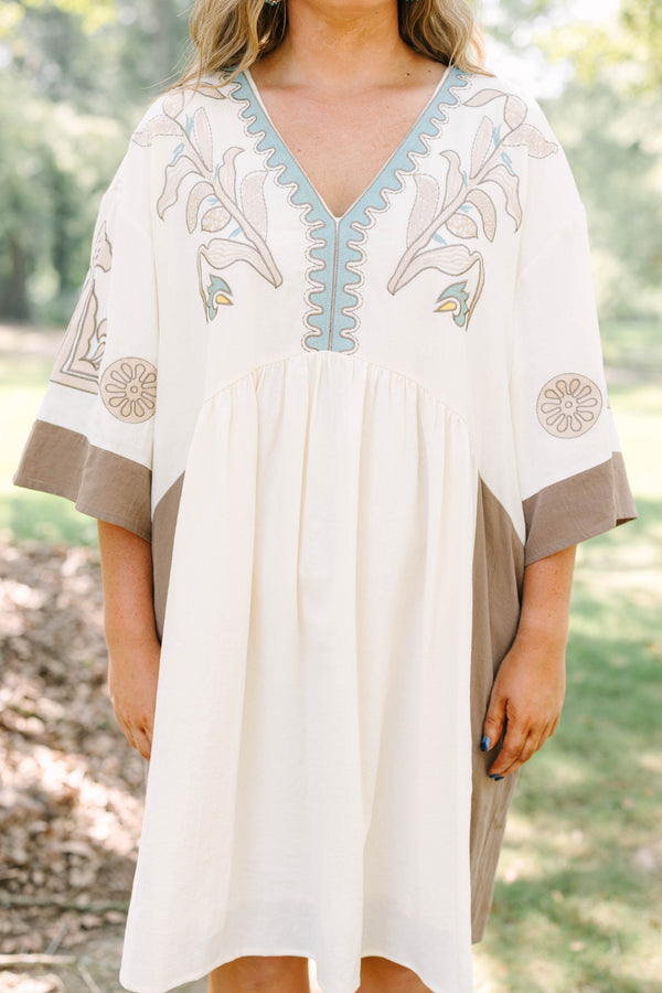 Plus Size cream and brown cotton dress with embroidered V-neckline and loose, wide sleeves.